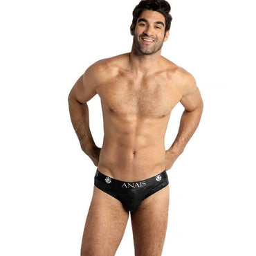 This image features a male model wearing the Anais Men - Electro Slip L, a pair of men's briefs underwear. The underwear is black with a subtle, high-quality military print that adds a touch of elegance. Anais Men Electro Slip soft microfiber men's slip underwear with military print