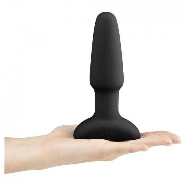Experience rimming and prostate pleasure with B-Vibe Rimming Anal Plug Two. Rotating beads, strong vibrations, remote control, and body-safe silicone design.4
