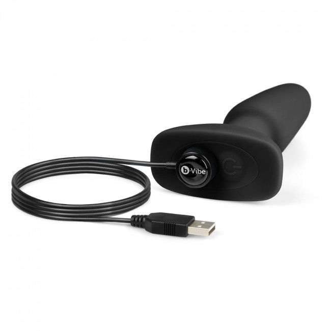 Experience rimming and prostate pleasure with B-Vibe Rimming Anal Plug Two. Rotating beads, strong vibrations, remote control, and body-safe silicone design.6