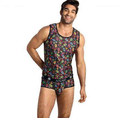 A man wearing a colorful floral and skull print tank top with the brand name 'ANAIS' visible on the waistband.