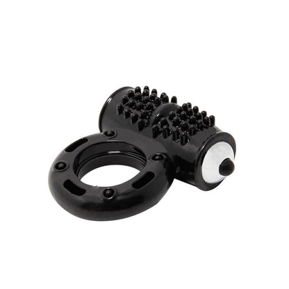 A black vibrating penis ring with a textured surface and a metallic ring at the base. The device appears to be compact and flexible.