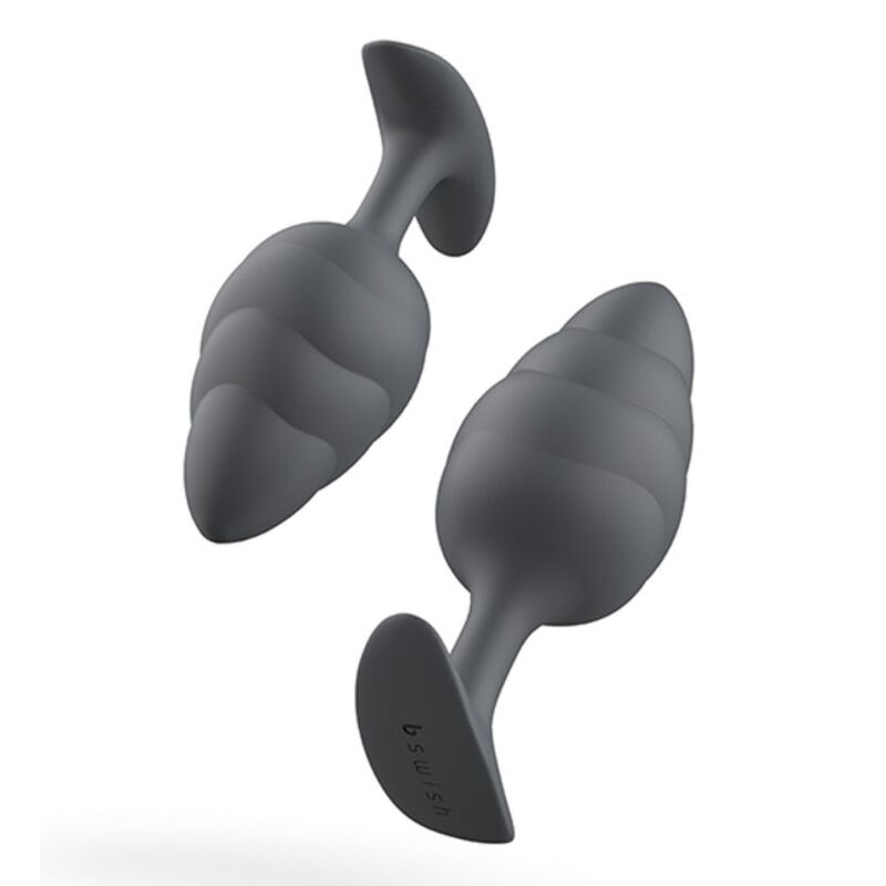 Experience new sensations with the B Swish Bfilled Butt Plug. Tapered tip, wave texture, body-safe silicone, and free-floating weight for ultimate pleasure.4