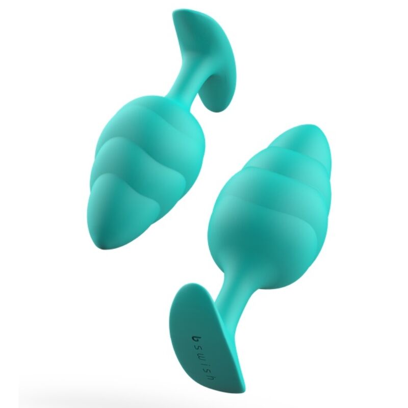 Experience new sensations with the B Swish Bfilled Butt Plug. Tapered tip, wave texture, body-safe silicone, and free-floating weight for ultimate pleasure.8