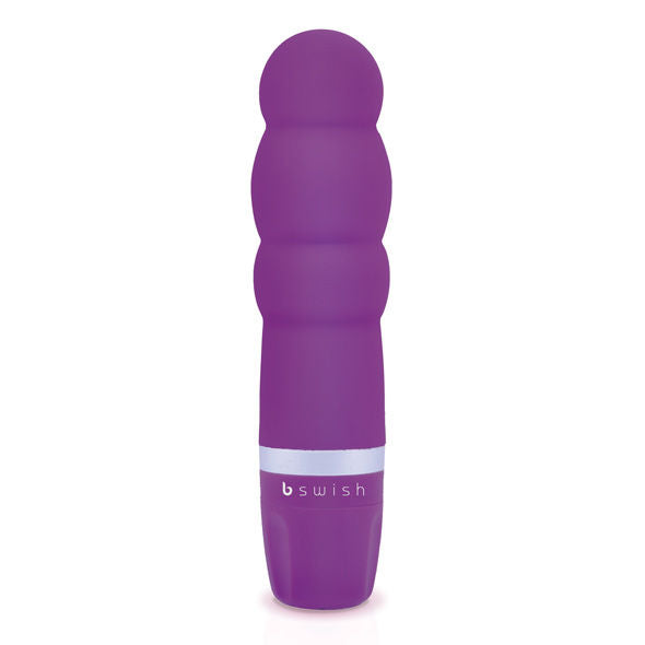 Enjoy precise pleasure with the B Swish Classic Clitor Stimulator. Ergonomic, waterproof, and silky soft silicone design with adjustable vibrations. Available in blue, pink, and purple.2